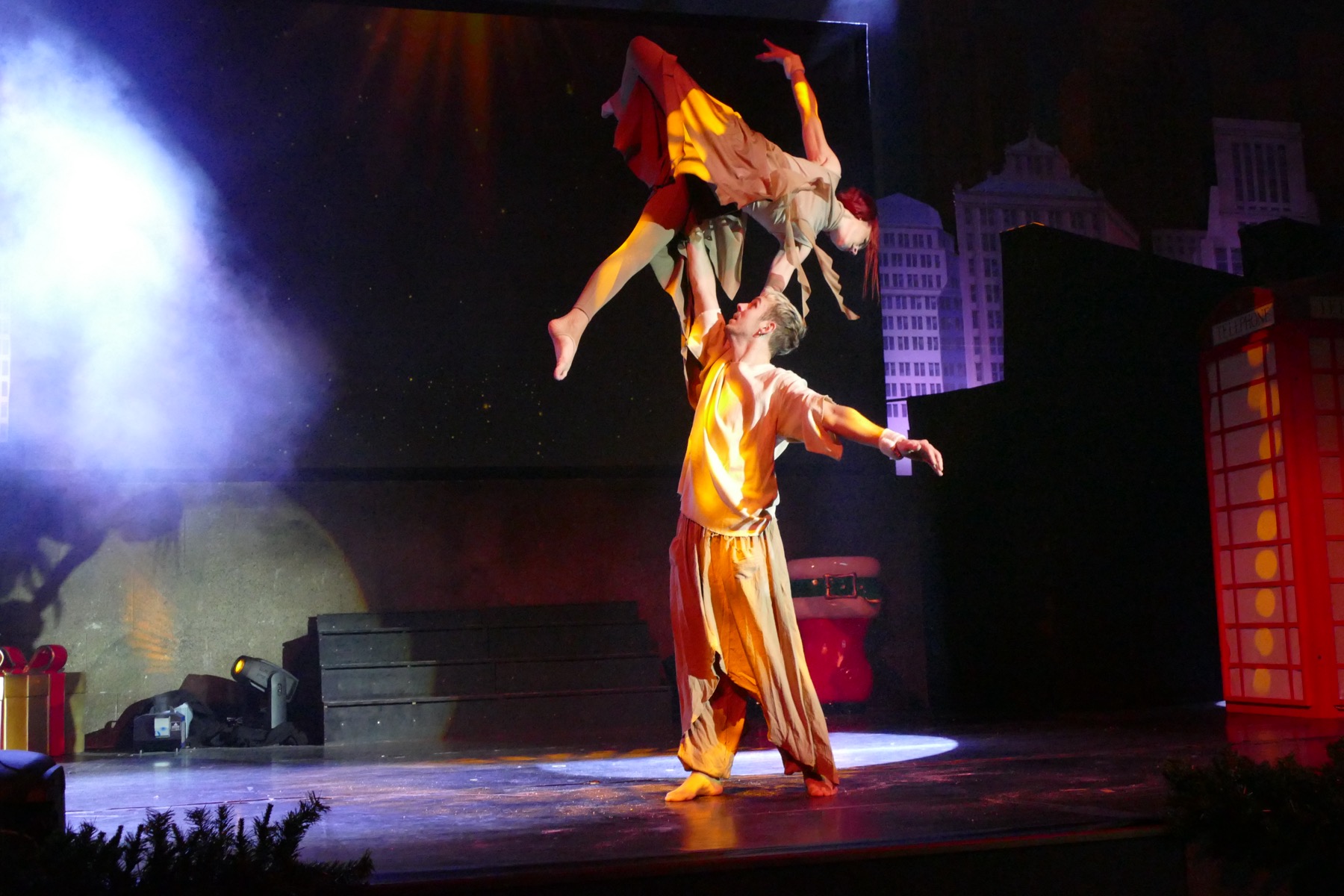 Winter-themed duo acrobatic lift on stage
